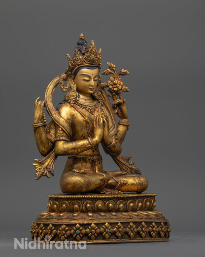 Side view of Chenrezig with four arms and swirling robes on lotus pedestal
