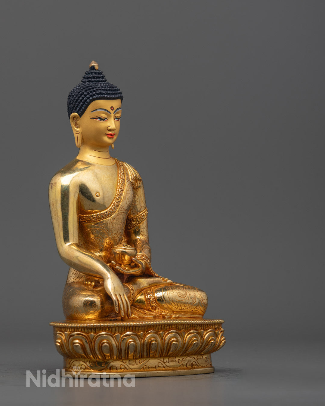 Side view of Complete Siddhartha Buddha sculpture on lotus base, featuring subdued deities