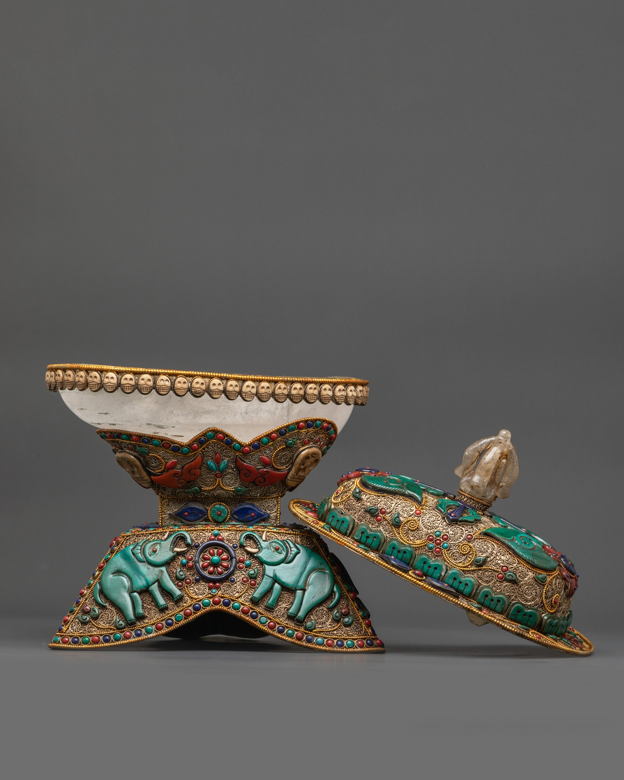 Side view of Crystal Kapala showing intricate filigree patterns and symbolic designs
