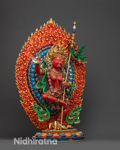 Side view of Dorje Phagmo statue with flowing serpents and detailed adornments
