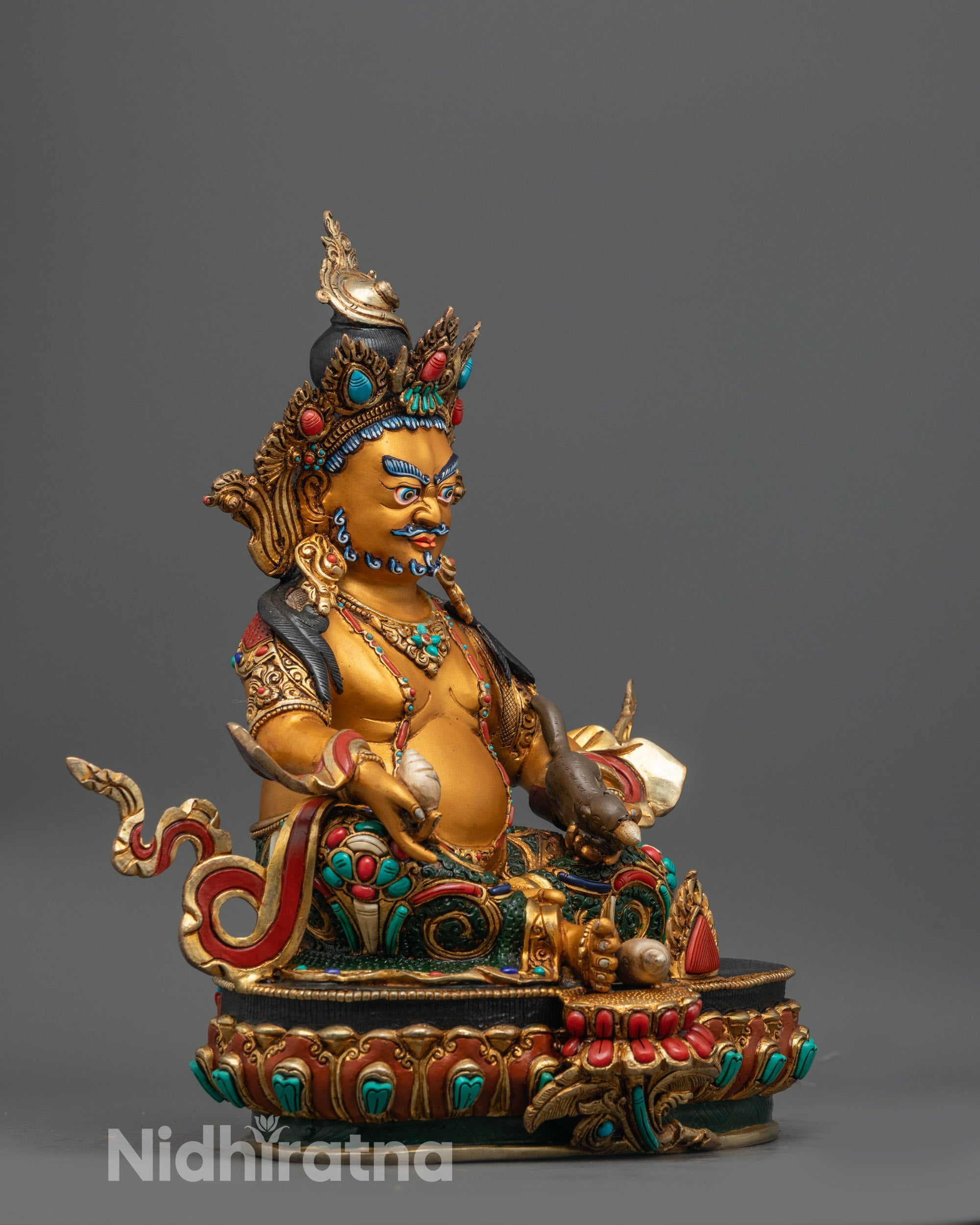 Side view of Dzambhala Sculpture highlighting gold-plated lotus seat and vibrant colors