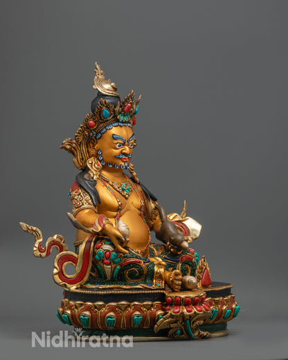 Side view of Dzambhala Sculpture highlighting gold-plated lotus seat and vibrant colors
