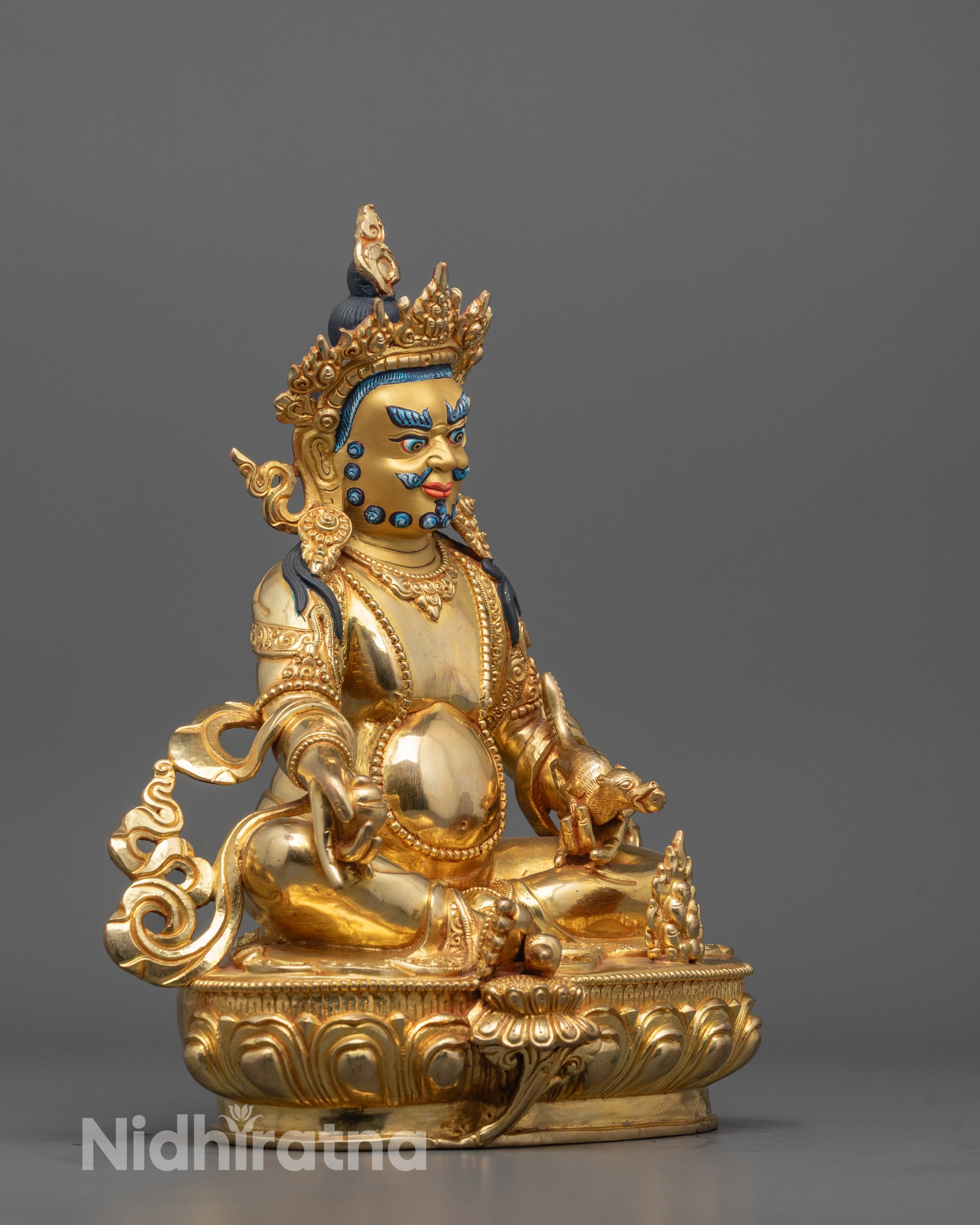 Side view of Dzambhala Statue showing detailed lotus seat and symbolic mongoose