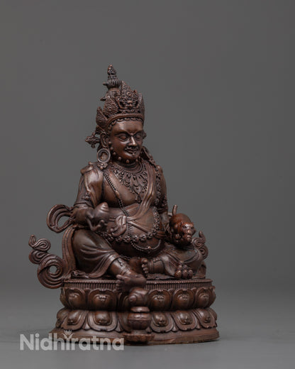 Side view of Dzambhala deity showing citron fruit and intricate lotus throne design