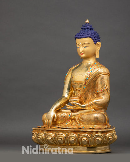 Side view of Enlightened Buddha Statue holding monk’s bowl, showcasing intricate gold gilding and lotus seat