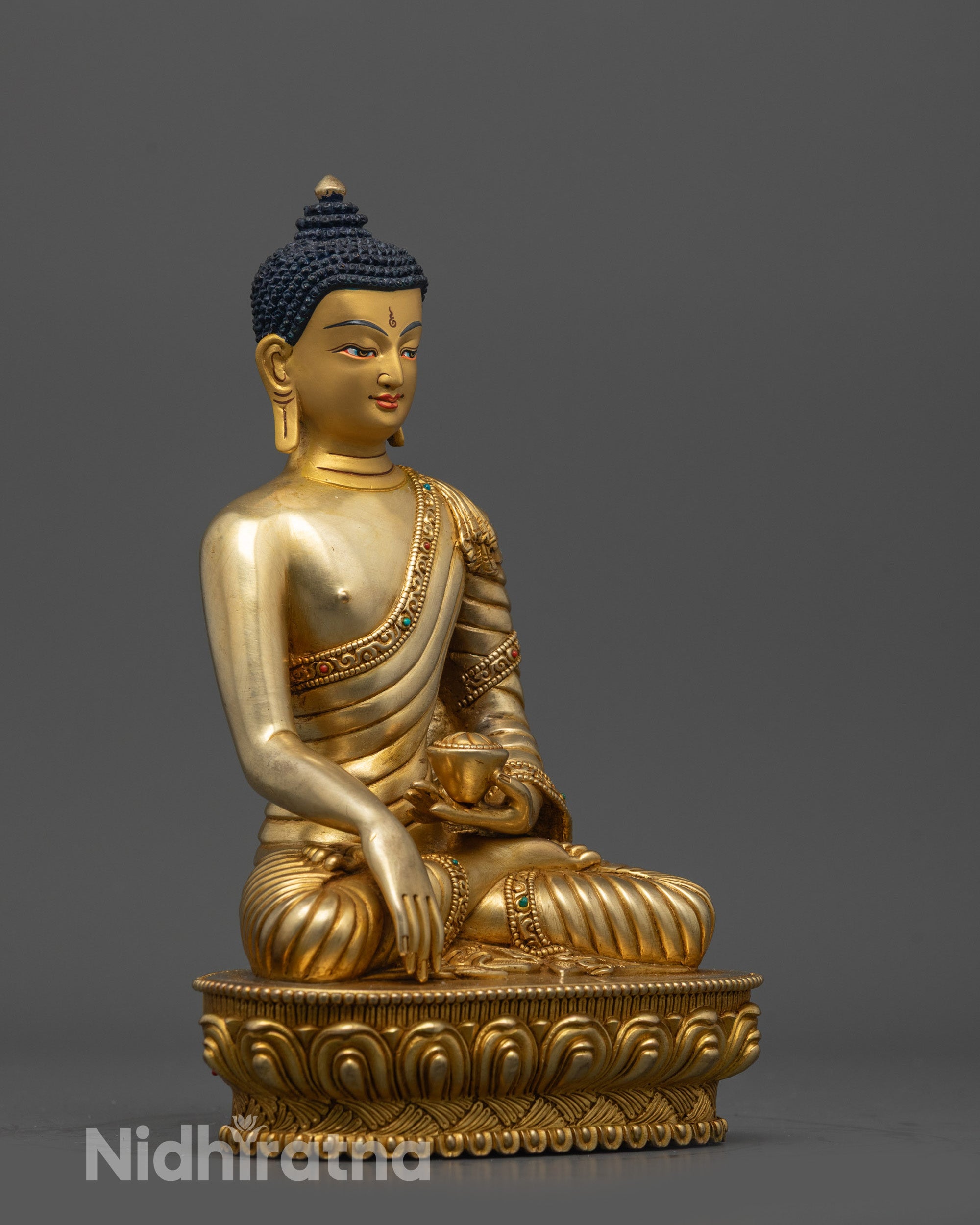 Side view of Enlightened Shakyamuni Buddha seated in lotus seat with Earth-touching mudra
