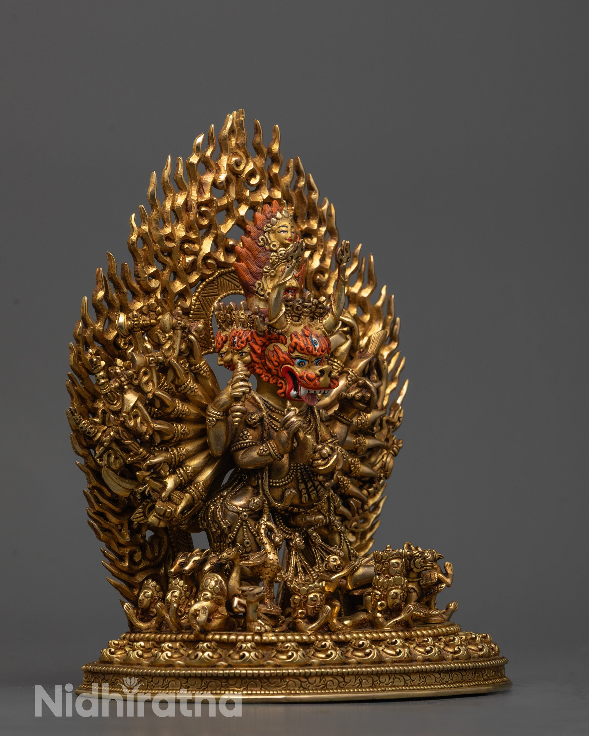 Side view of Fierce Yamantaka Buddhist statue holding curved knife with vajra handle
