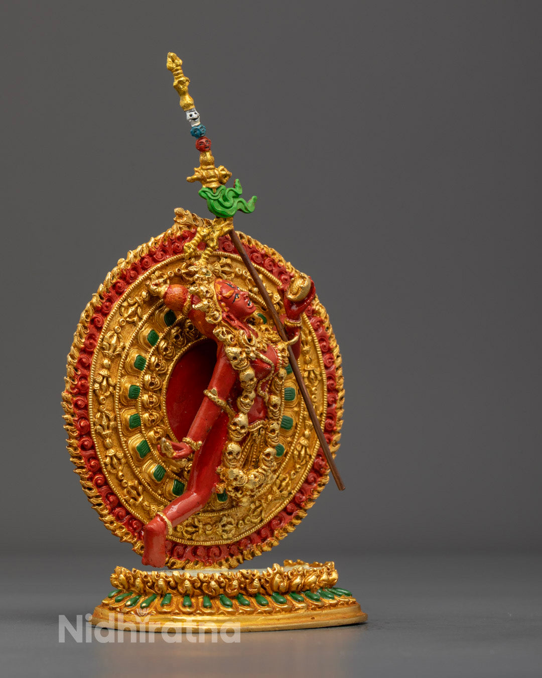 Flying Vajrayogini statue highlighting multiple arms and skull crown, crafted with premium copper and gold finish.