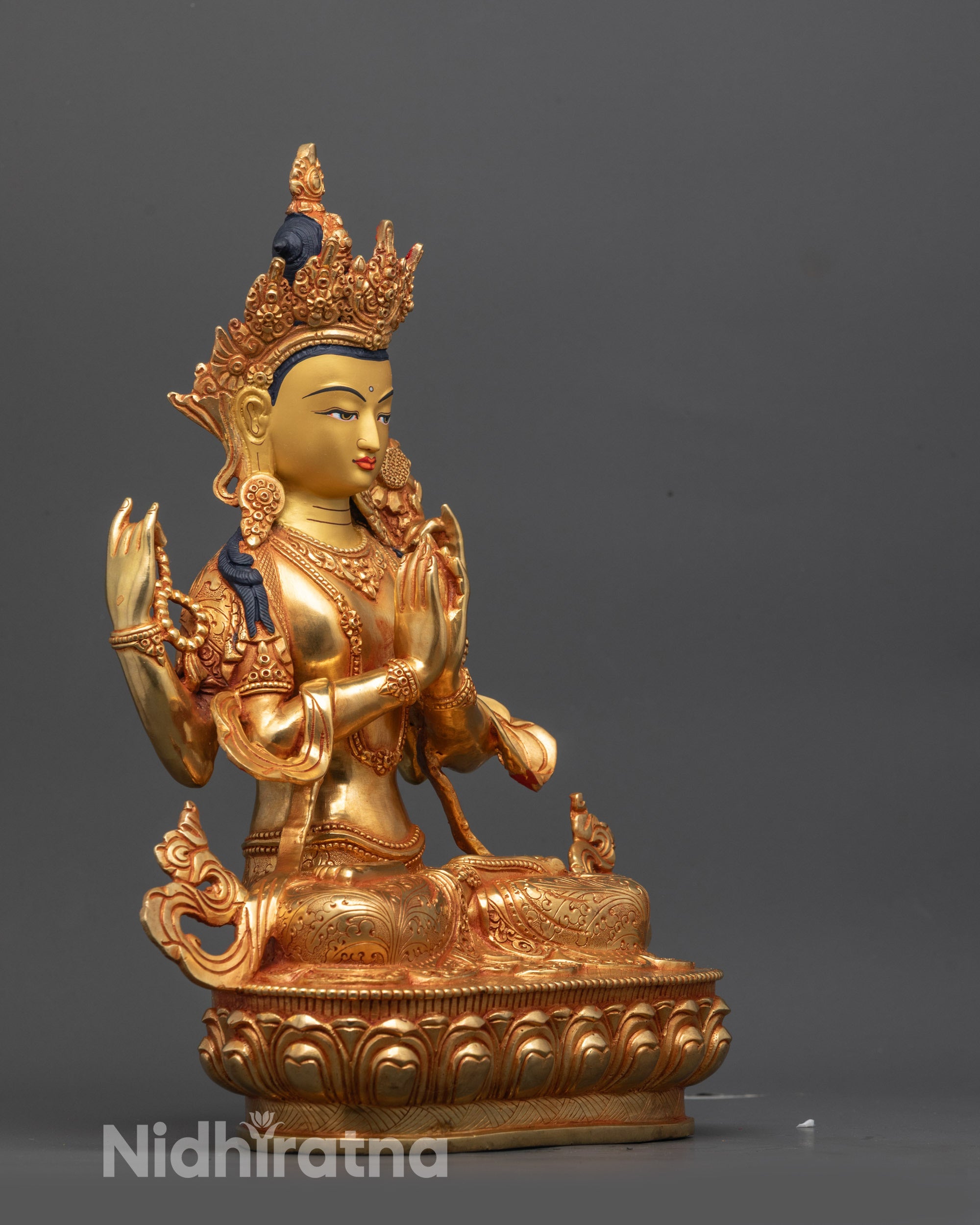 Side view of Four-Armed Avalokiteshvara Statue highlighting copper craftsmanship and gilding