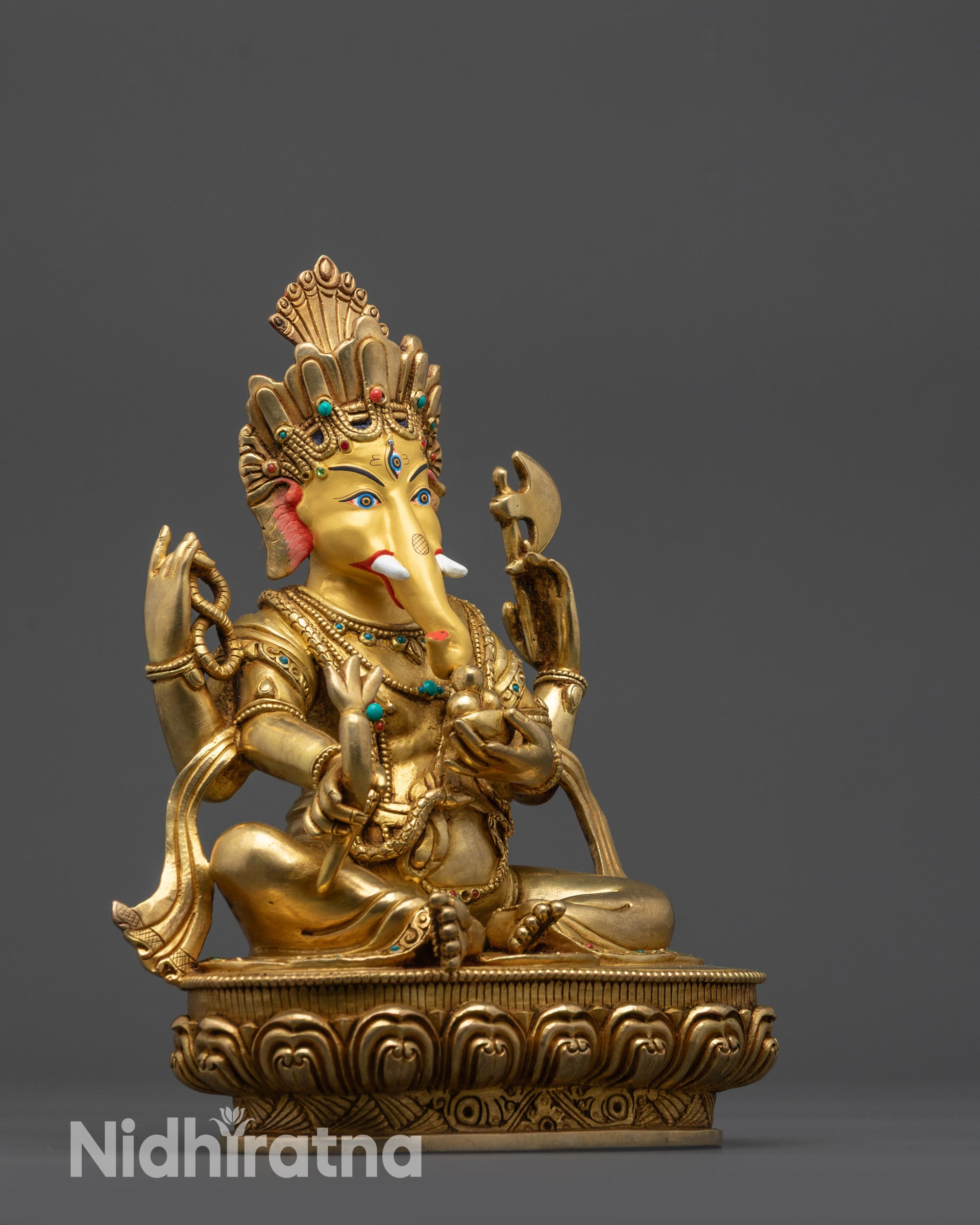 Side view of Four-Armed Ganesha holding goad, noose, modaka, and showing mudra