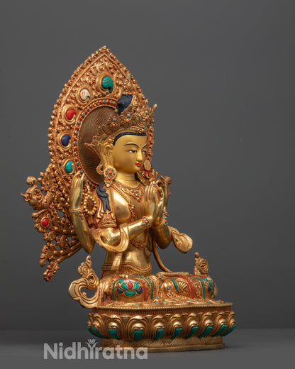 Side view of Four-armed Chenrezig Statue adorned with coral, lapis lazuli, and turquoise