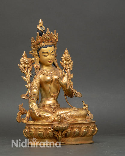 Side view of Green Tara Himalayan goddess sculpture, Varada and Vitarka mudra blessings
