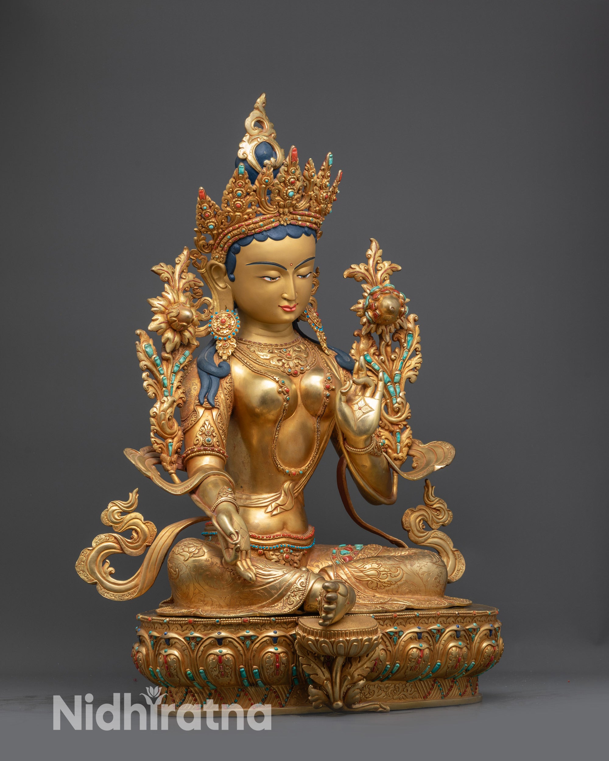 Side view of Green Tara Statue showing flowing robes and lotus throne