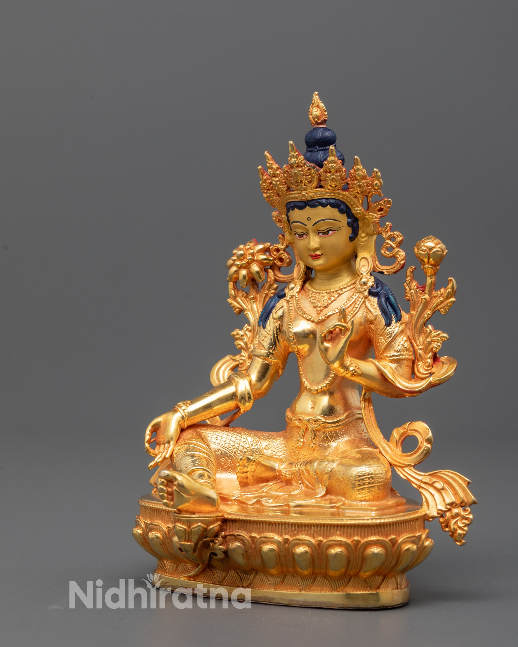Side view of Green Tara Statue showing intricate design and serene expression