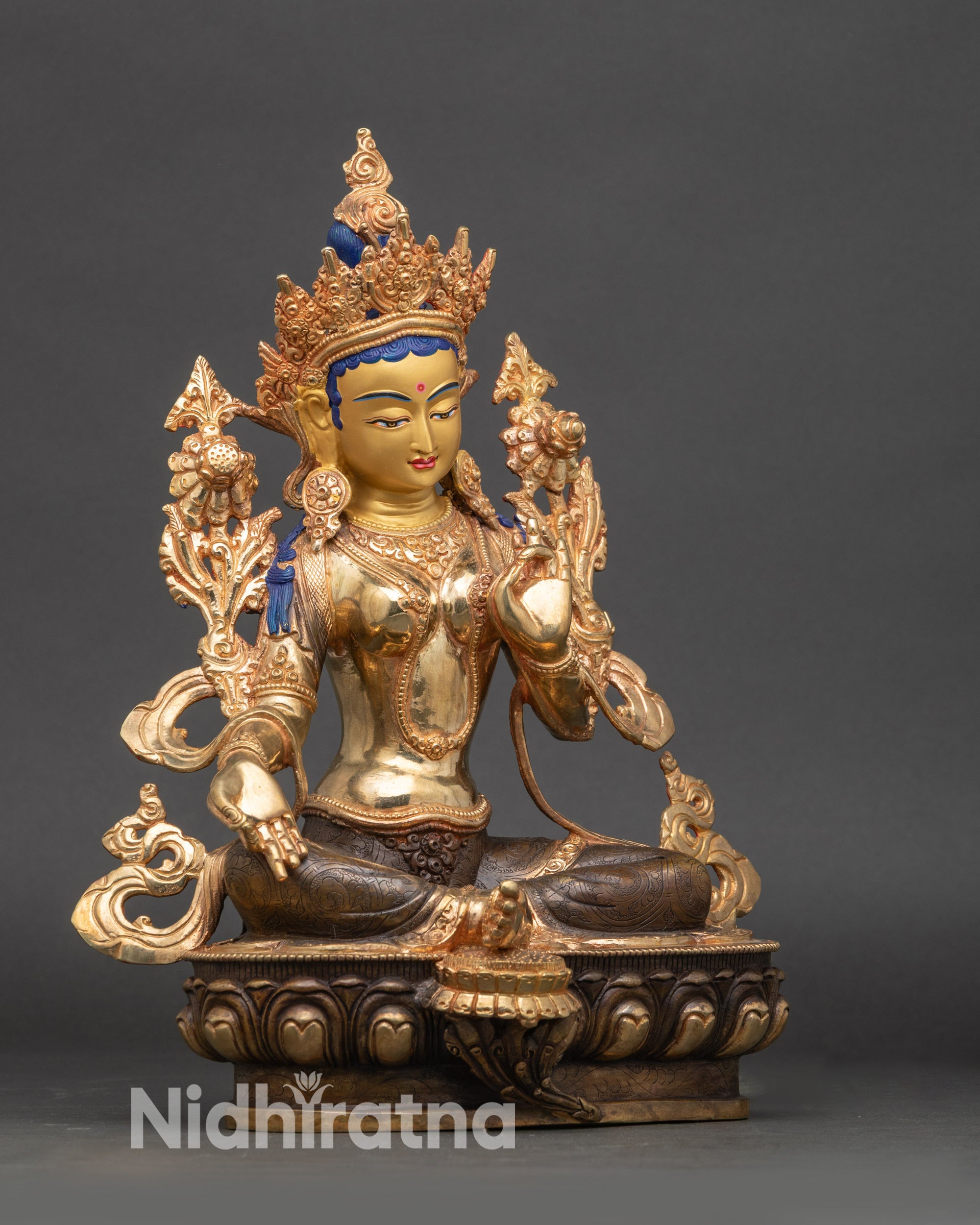 Side view of Green Tara meditation statue showing Varada and Abhaya Mudra hands