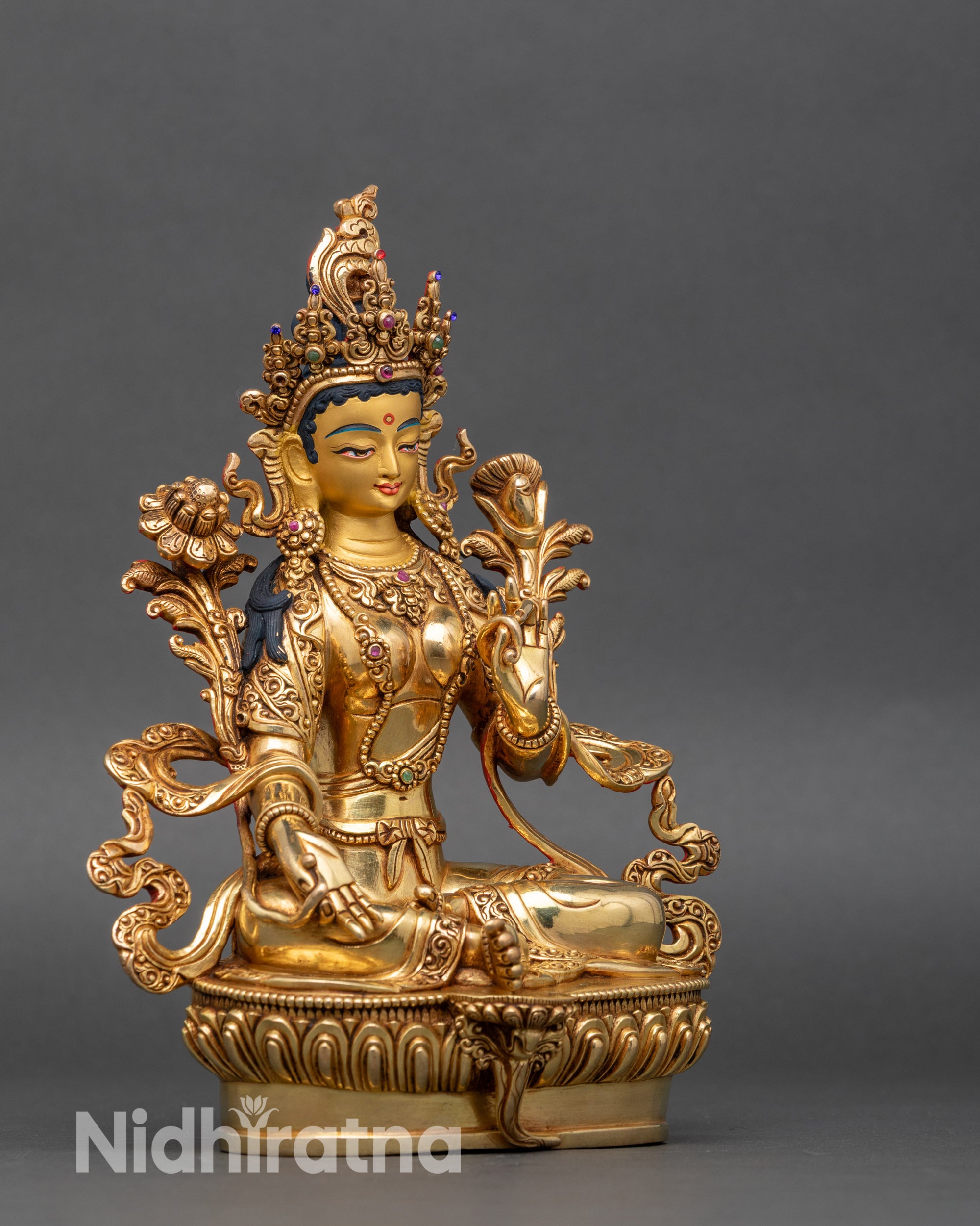 Side view of Green Tara statue, detailed lost-wax copper craftsmanship
