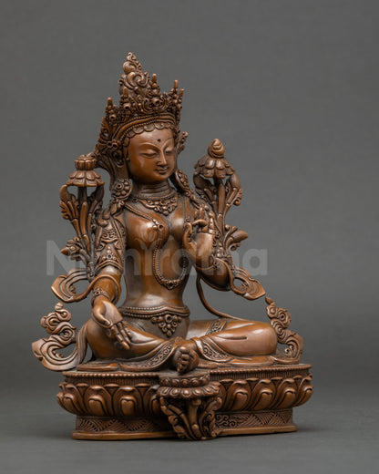 Side view of Green Tara statue, lost-wax Nepalese copper with gold-accented lotus throne
