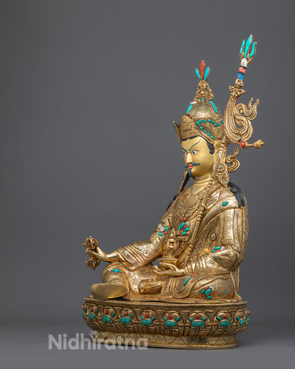Side view of Guru Rinpoche Sculpture highlighting intricate carvings on the lotus throne and detailed acrylic painting
