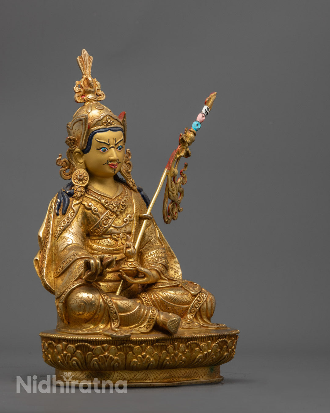 Guru Rinpoche Statue showing intricate copper detailing and hollow chamber for mantra placement, traditional Nepalese craftsmanship.