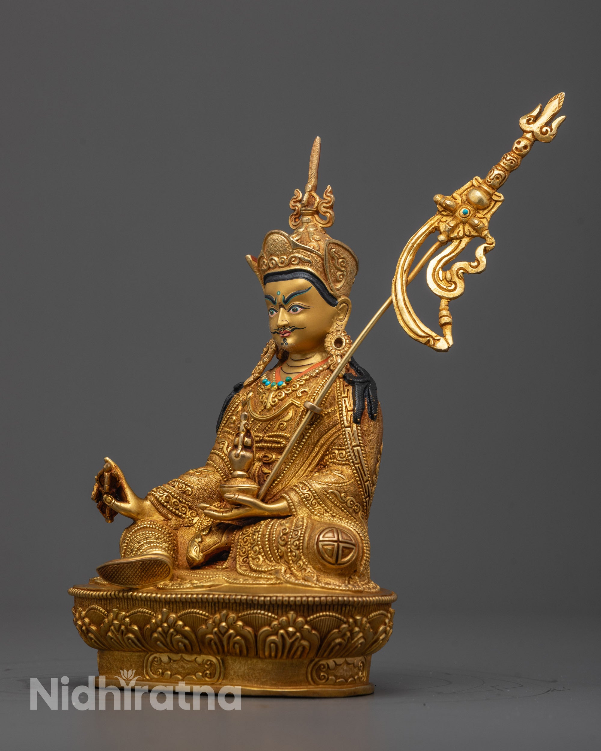 Side view of Guru Rinpoche copper statue showing consecration chamber detail