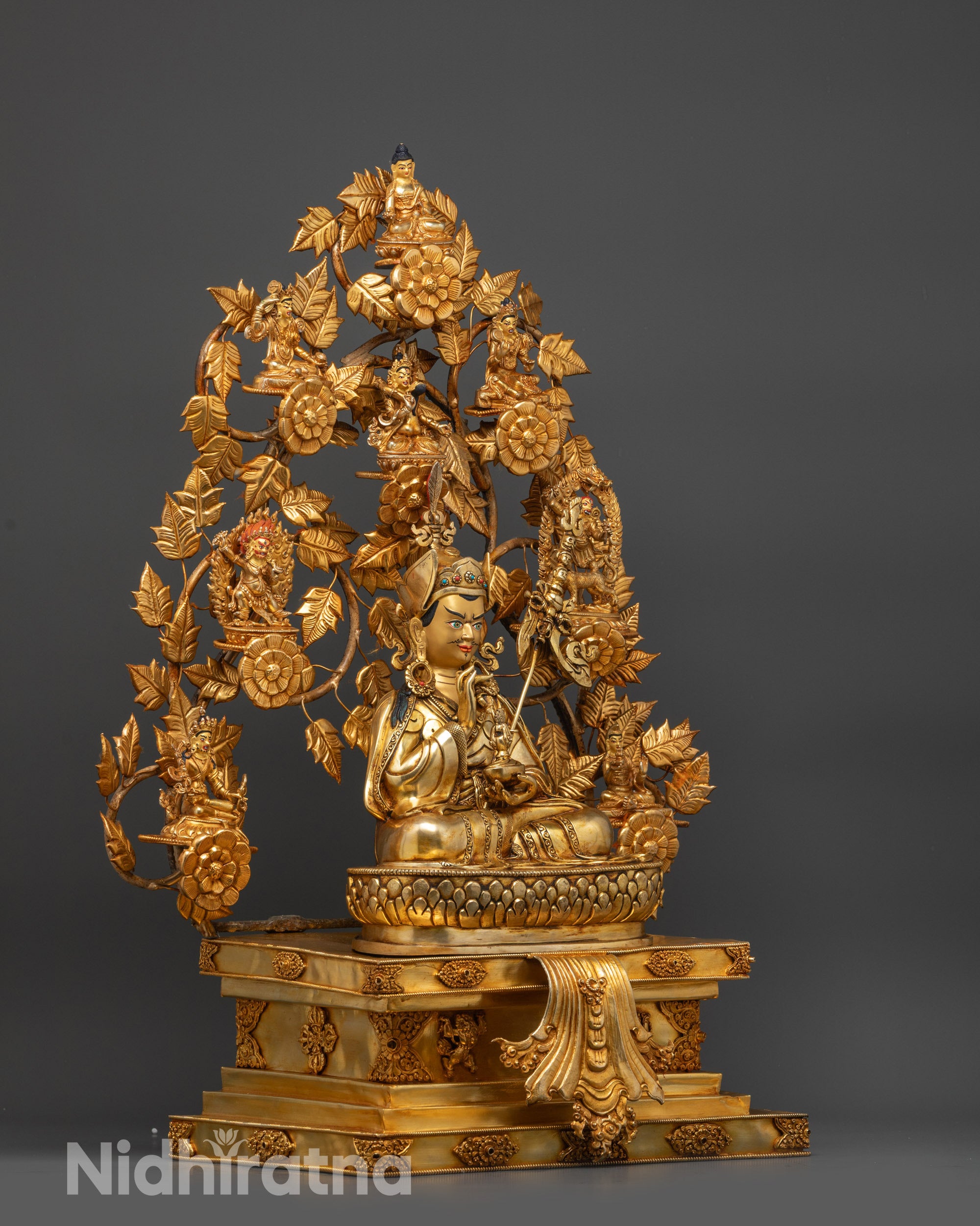 Side view of Guru Sangey Set Statue showing eight manifestations on leafy branches
