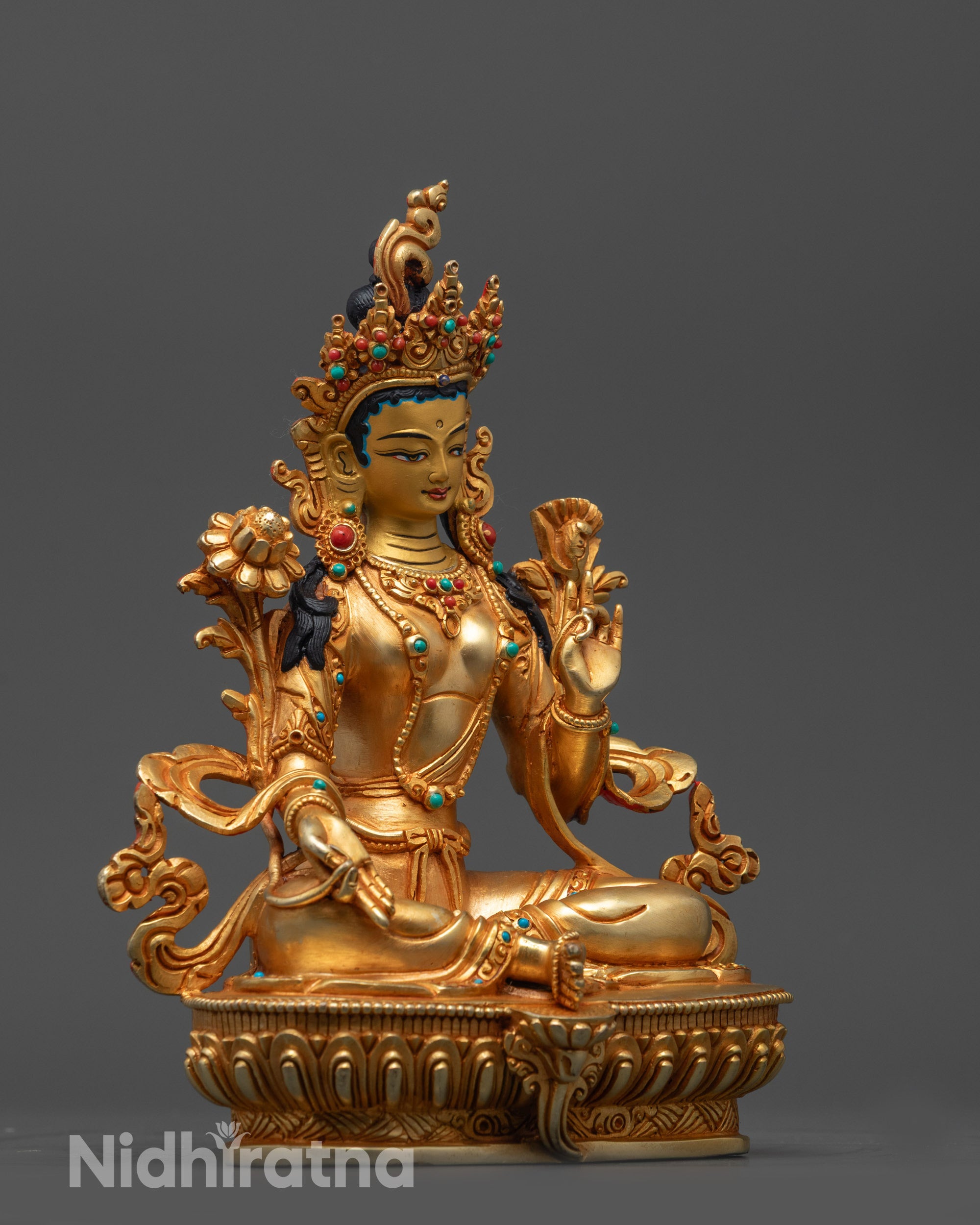 Side view of Hand-Carved Green Tara Statue highlighting gold fire-gilded body and crown