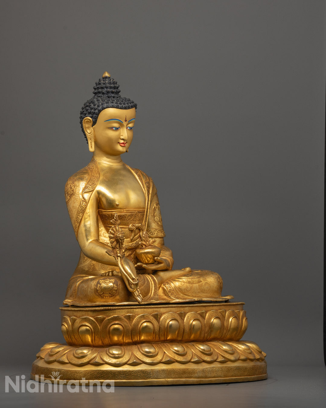 Side view of Hand-carved copper Buddha statue with 24k fire gold gilding