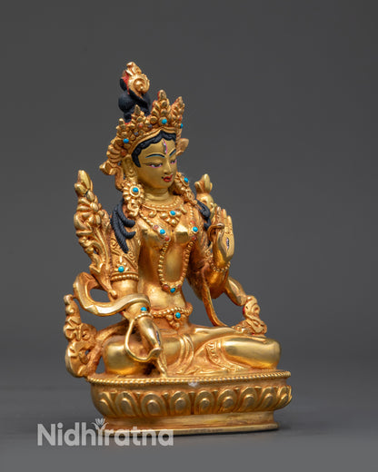 Side view of Healing White Tara sculpture with five-jewelled crown and layered jewelry
