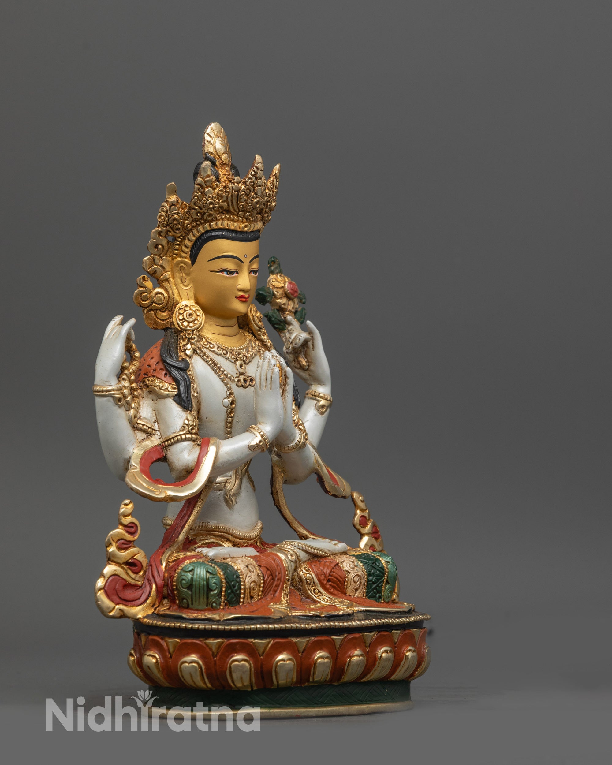 Side view of Himalayan Chenrezig Sculpture with floating robe gold-plated finish and carvings