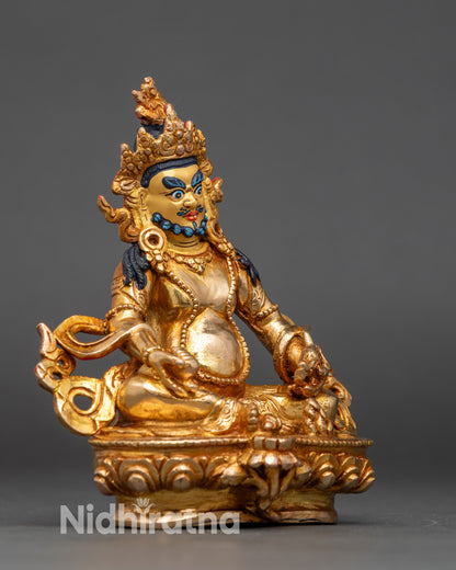 Side view of Himalayan Dzambhala Statue, gold-gilded copper, sacred Buddhist decor