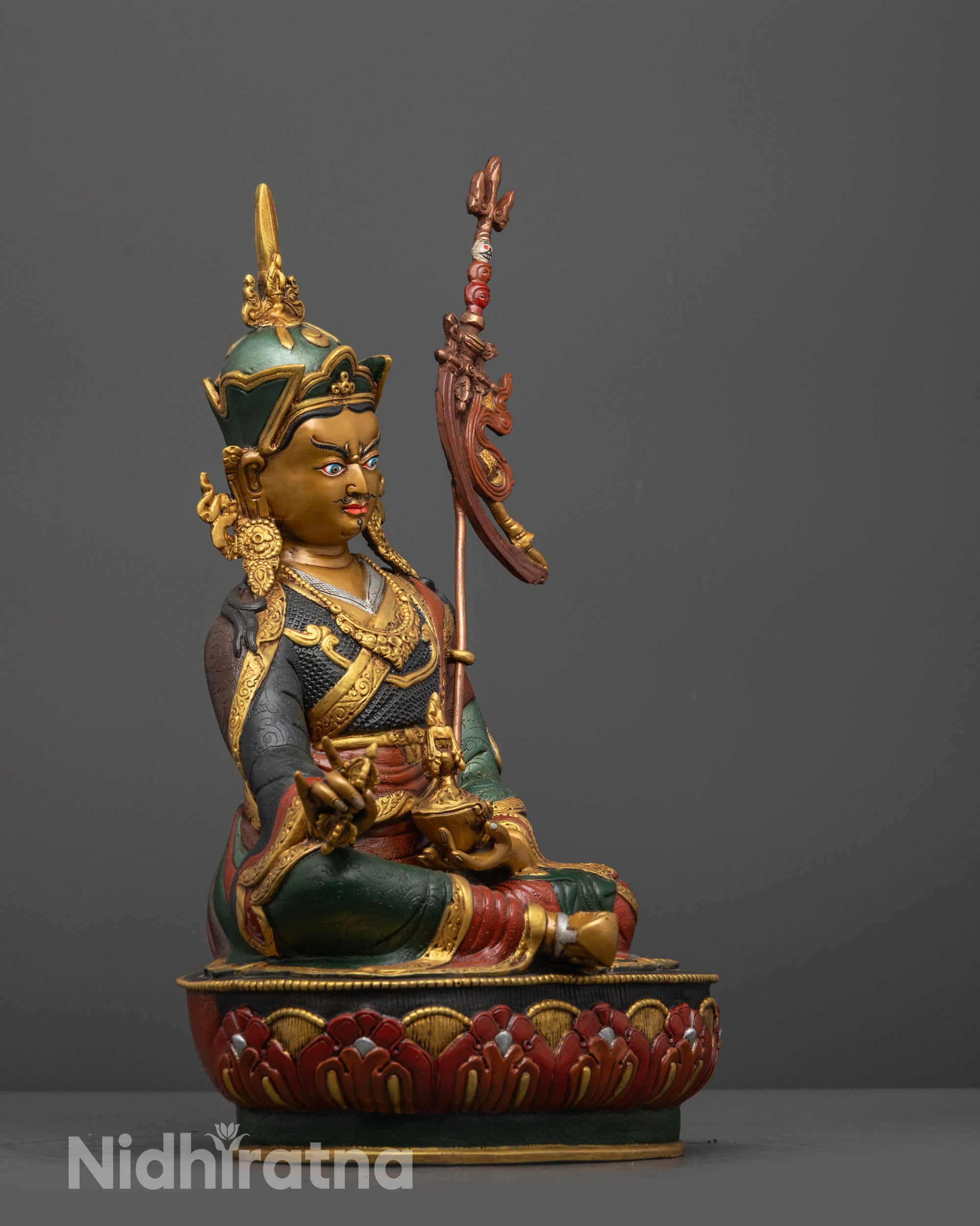 Side view of Himalayan Guru Padmasambhava statue with multi-colored Tripitaka robe details
