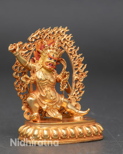 Side view of Himalayan Vajrapani statue holding vajra and lasso, symbol of spiritual protection