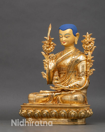 Side view of Je Tsongkhapa statue with flaming sword and Prajñāpāramitā Sutra