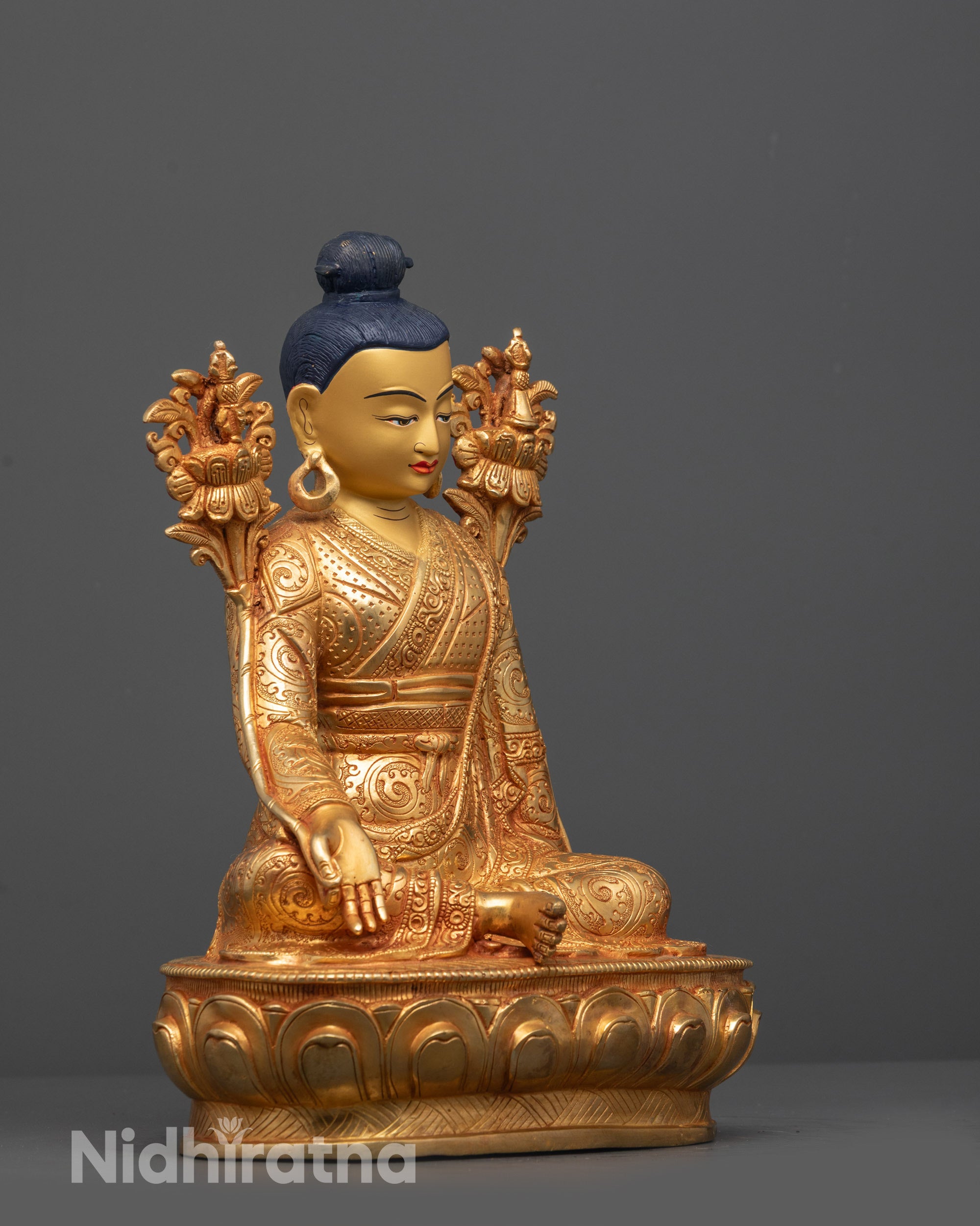 Side view of Jigme Lingpa Statue highlighting lotus seat, peaceful posture