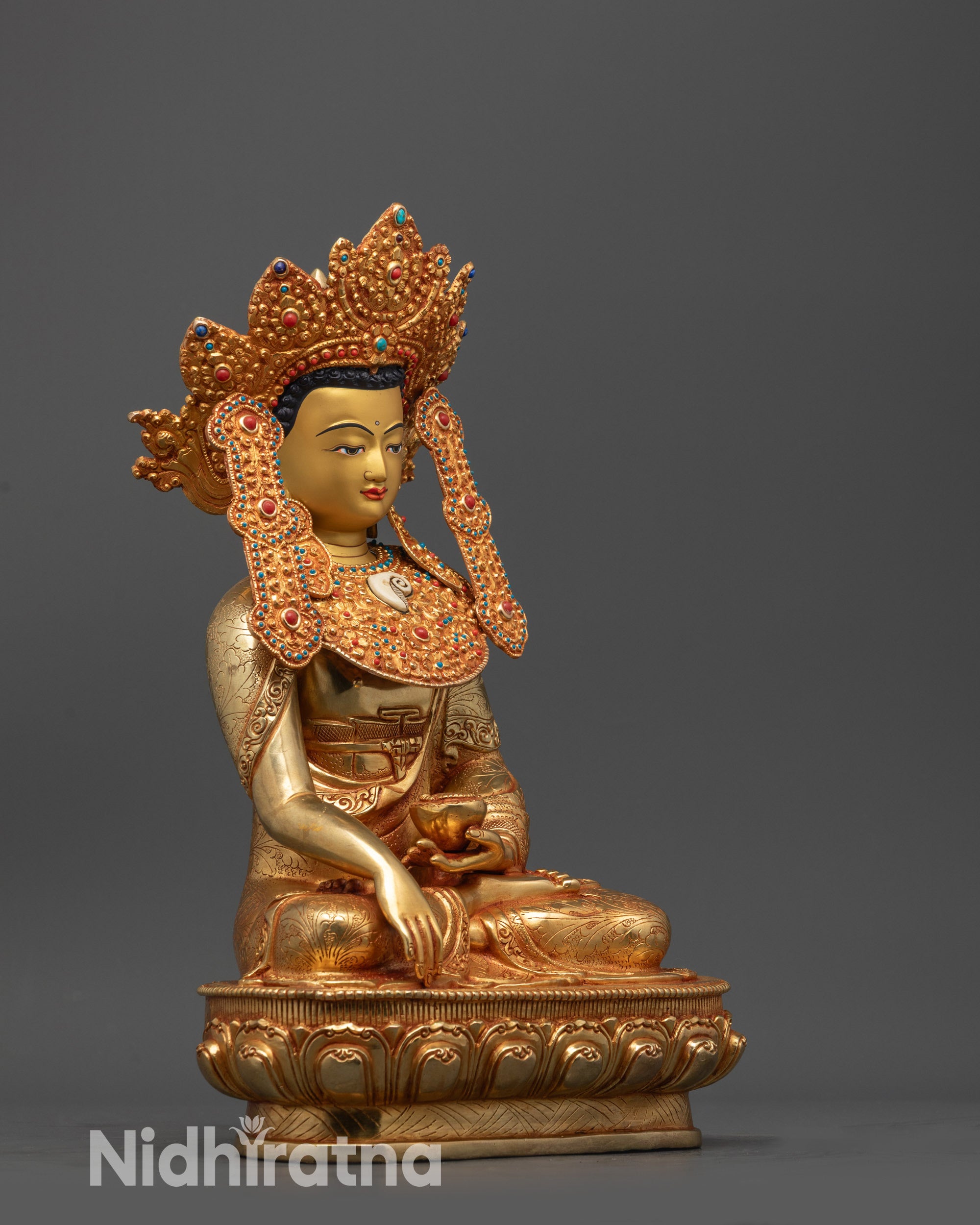 Side view of Jowo Shakyamuni Buddha statue showing gold fire-gilded crown and robes, Nepalese art
