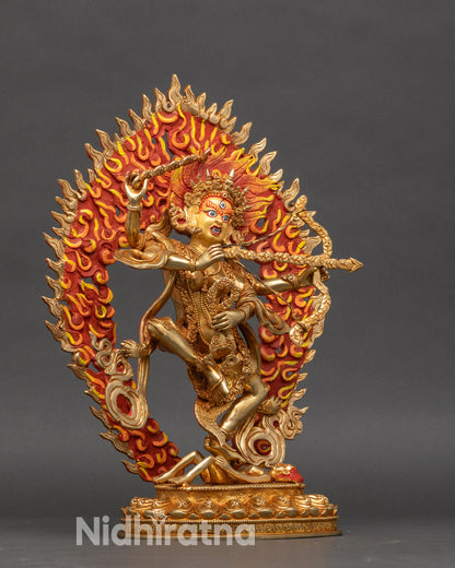 Side view of Kurukulla sculpture with gold fire-gilded finish and dynamic pose