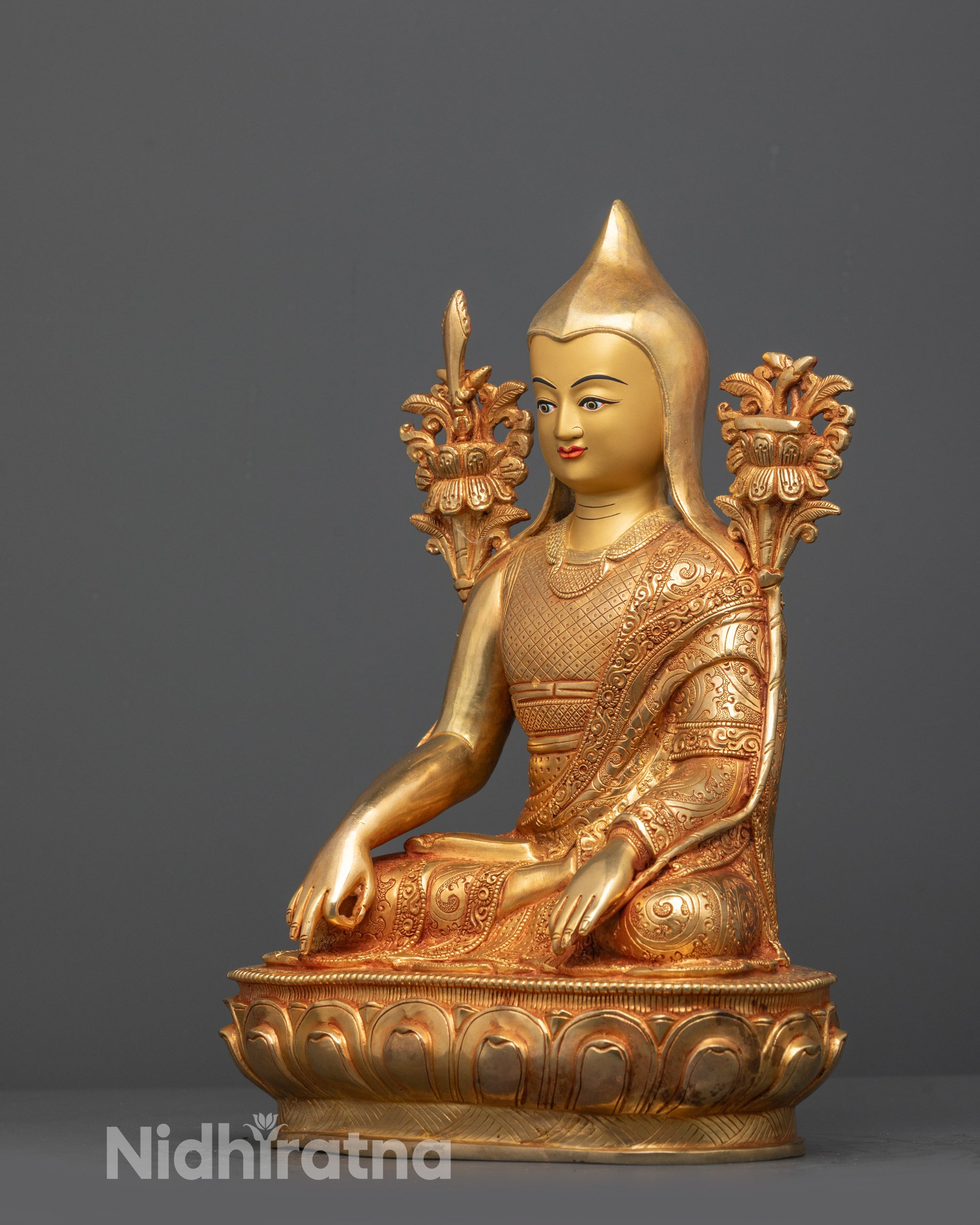 Side view of Longchenpa Statue displaying detailed robes, lotus seat