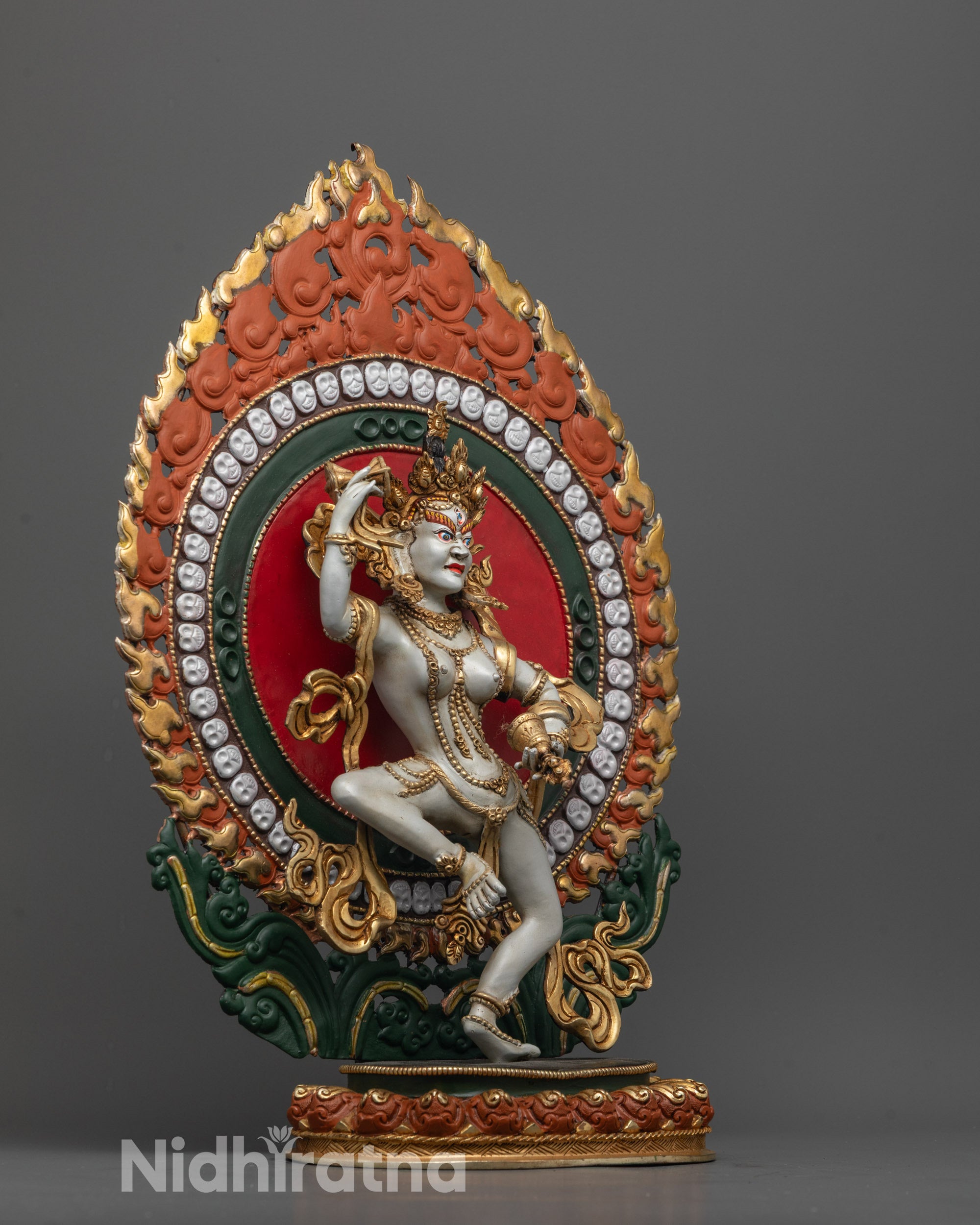 Side view of Machig Labdron Idol dancing on moon disc with flowing robes and vibrant colors