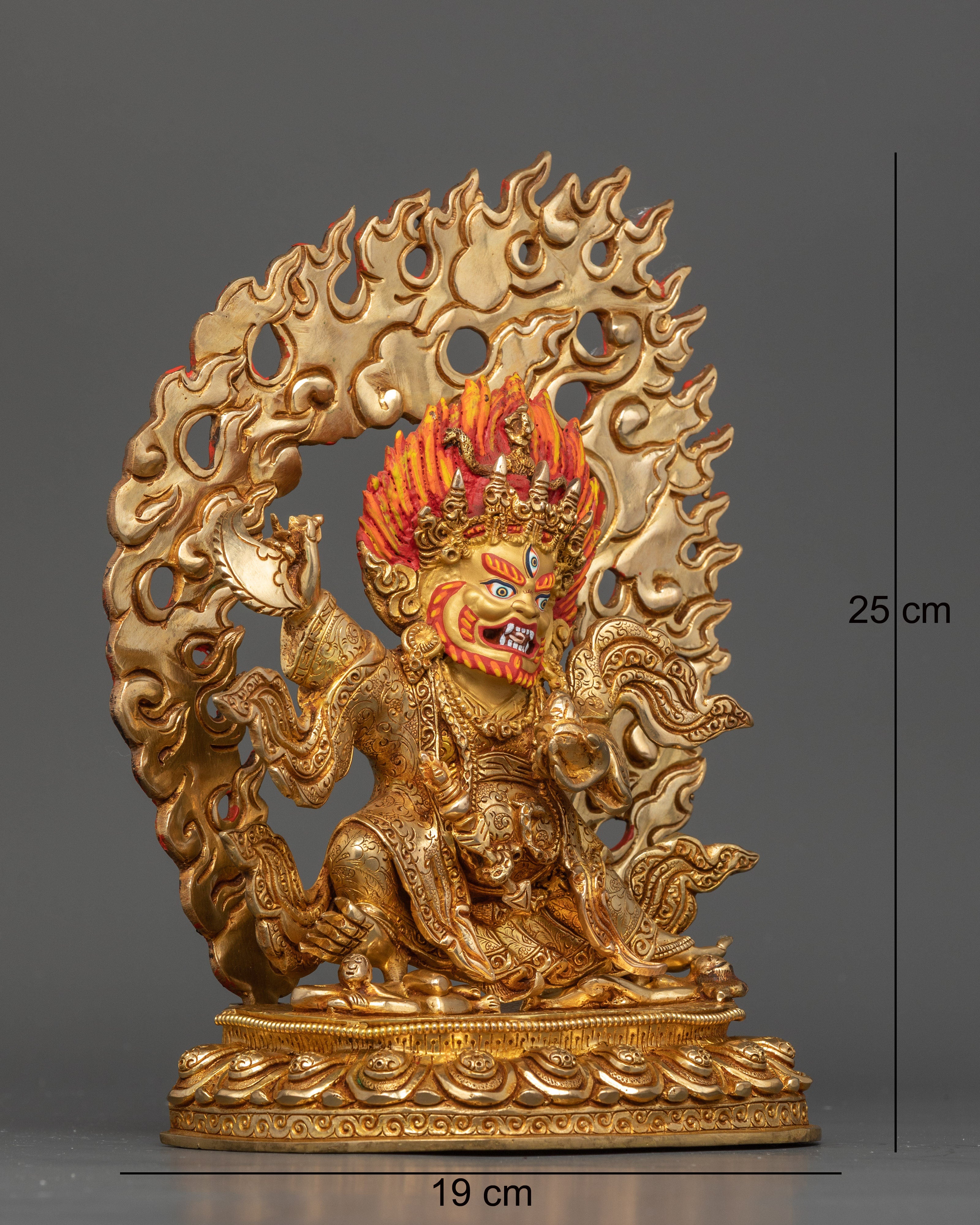 Side view of Mahakala Bernagchen triumphing over crushed evil entities, sacred Nepalese sculpture