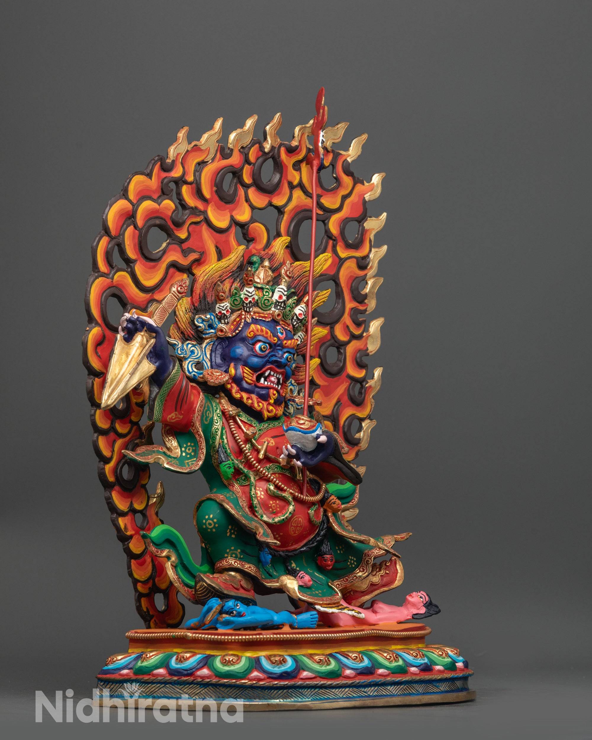 Side view of Mahakala Bernagchen with detailed painted robe and halo