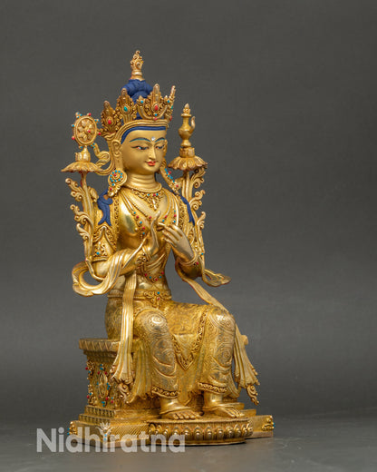 Side view of Maitreya Buddha statue in royal ease on carved lotus throne
