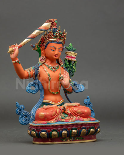 Side view of Manjushri Bodhisattva statue showing lotus and intricate Himalayan craftsmanship