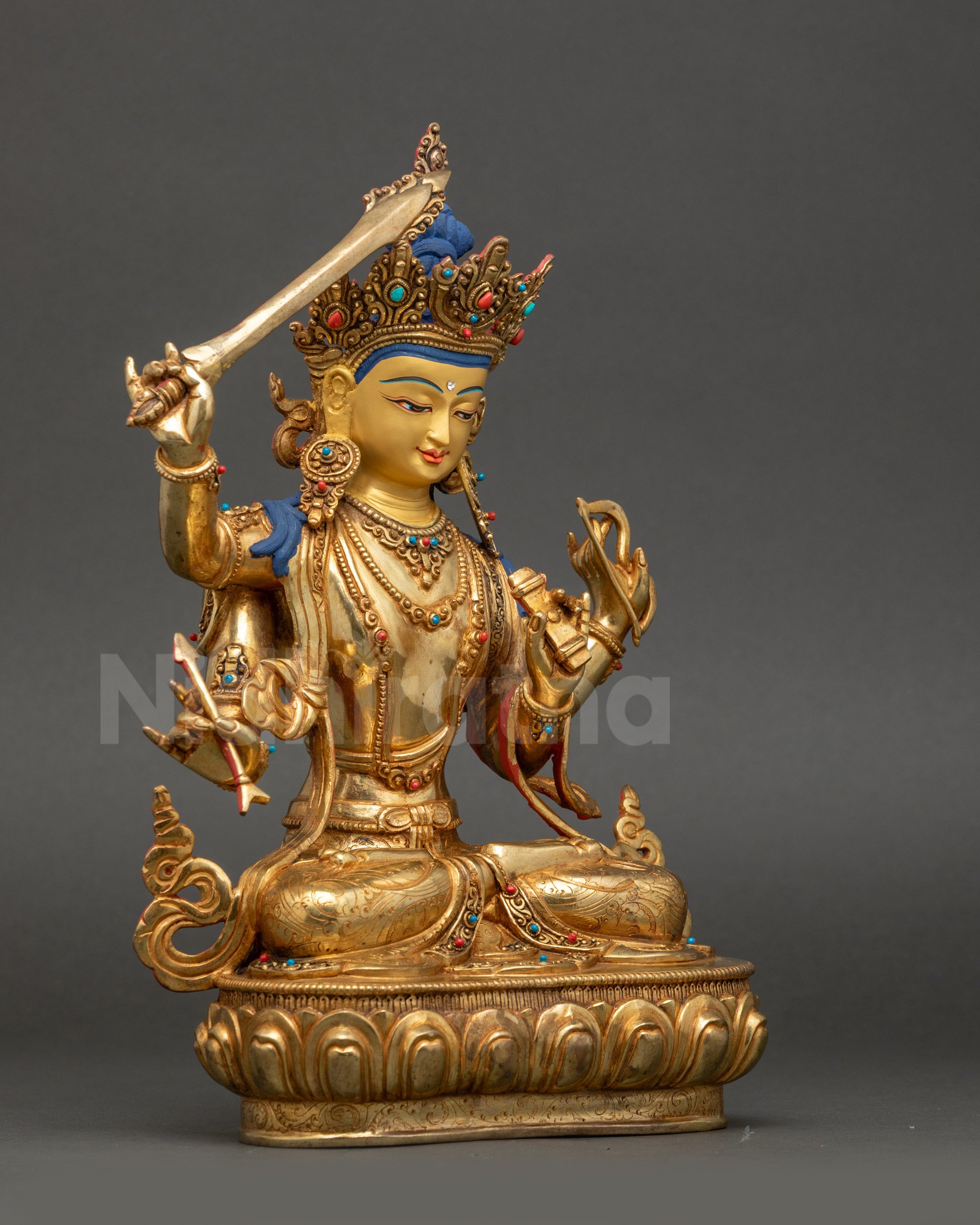 Side view of Manjushri Statue holding flaming sword and lotus with Prajnaparamita Sutra | Handcrafted Nepalese artwork