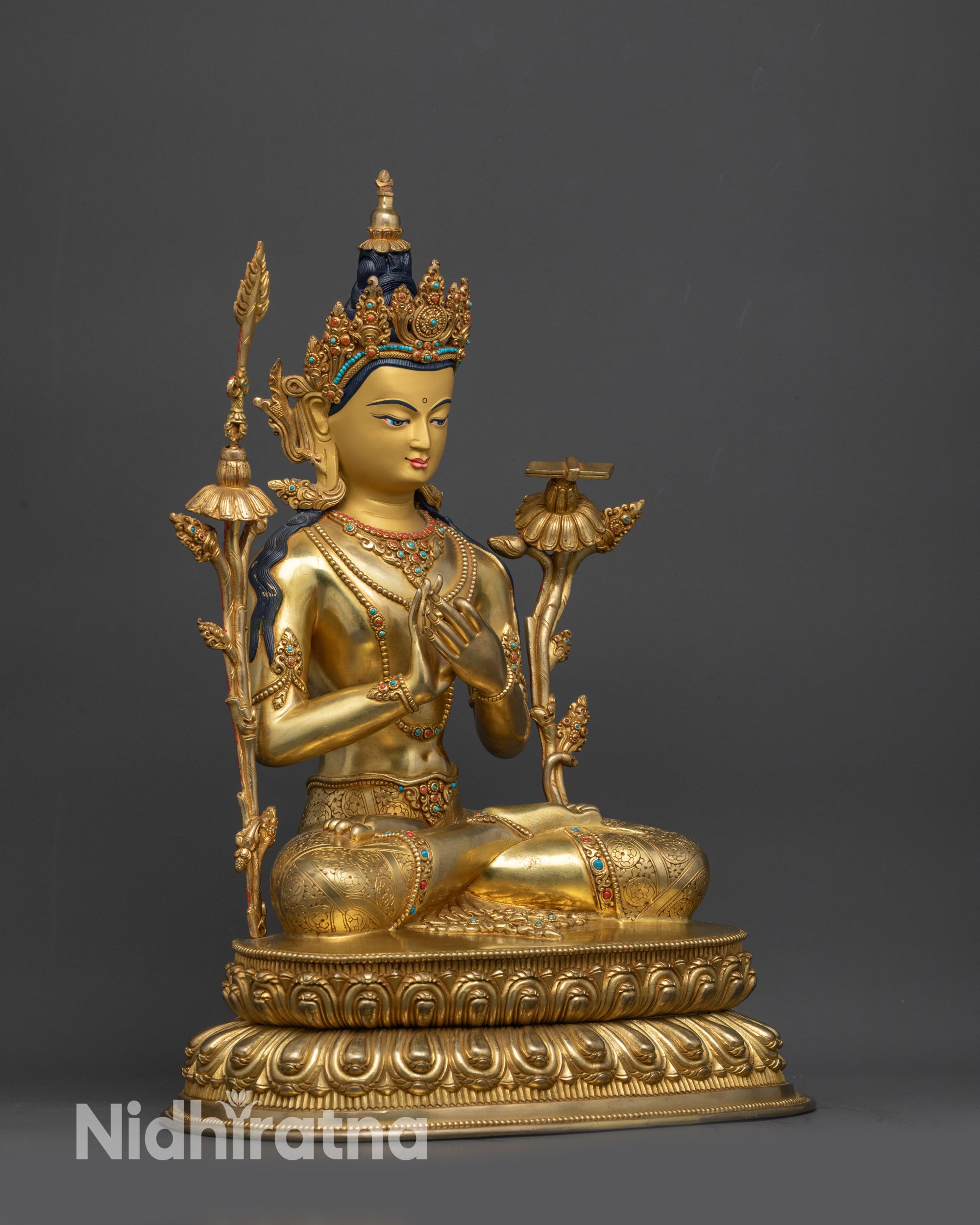 Side view of Manjushri holding utpala flower, wisdom sword, and Prajnaparamita scripture
