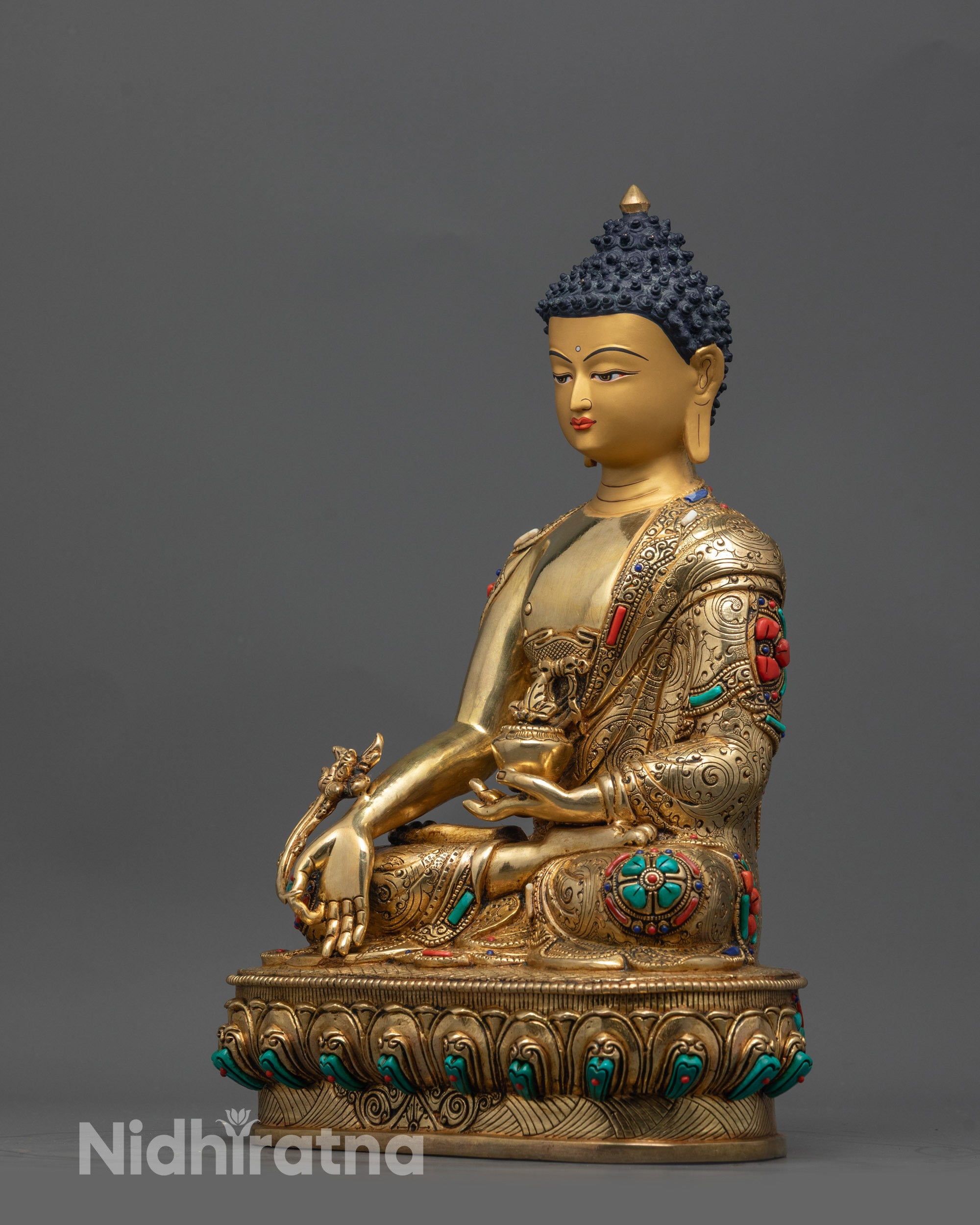 Side view of Medicine Buddha sculpture highlighting lotus position and dhyana mudra
