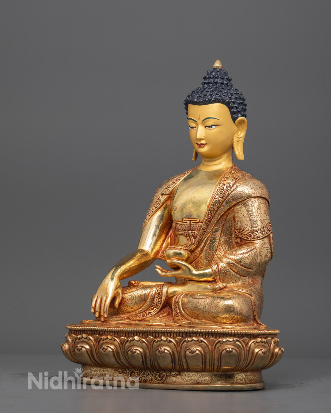 Side view of Meditating Buddha statue showing detailed robe carvings and patra bowl