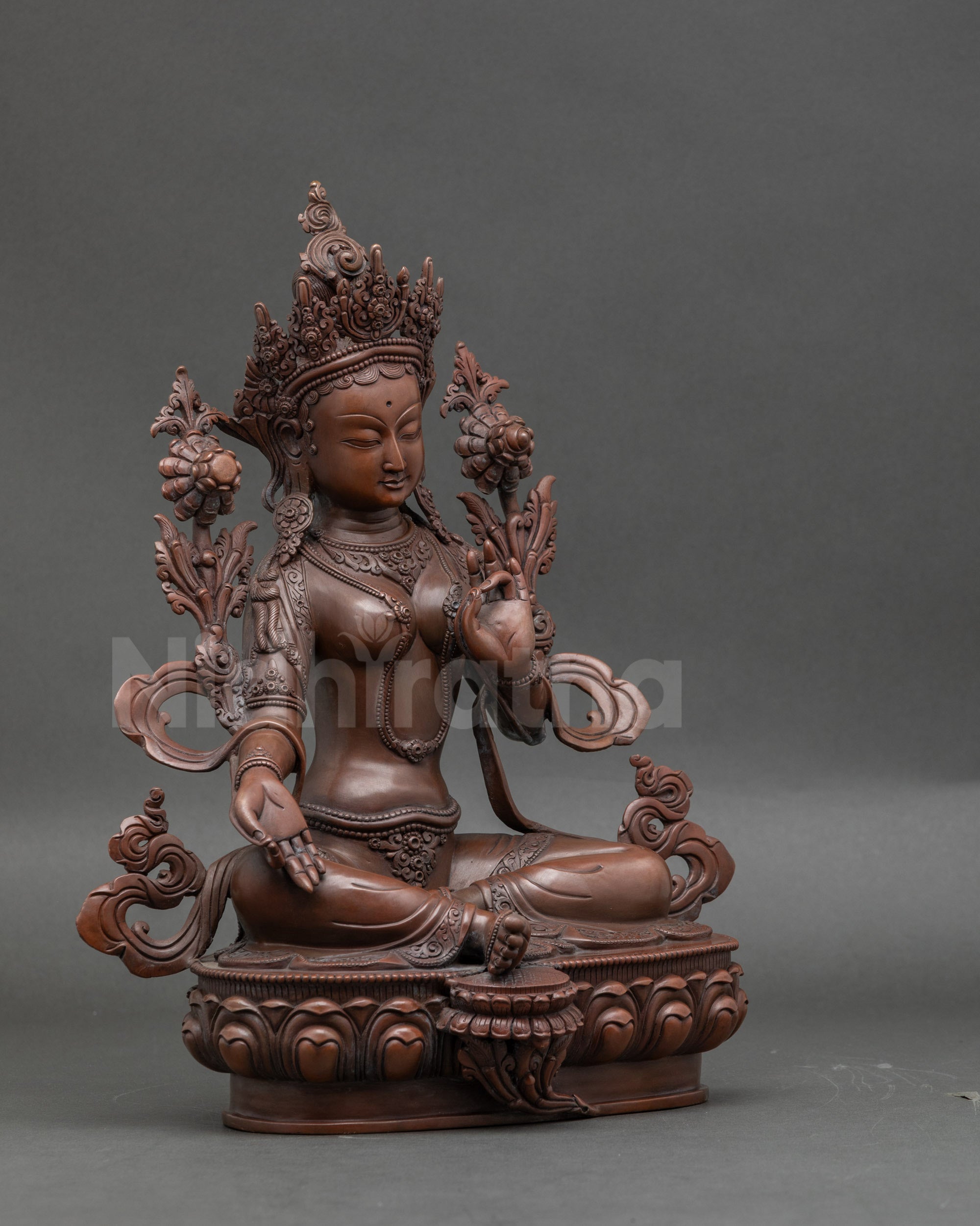 Side view of Mother of Liberation Tara statue, sacred Buddhist statue for altars