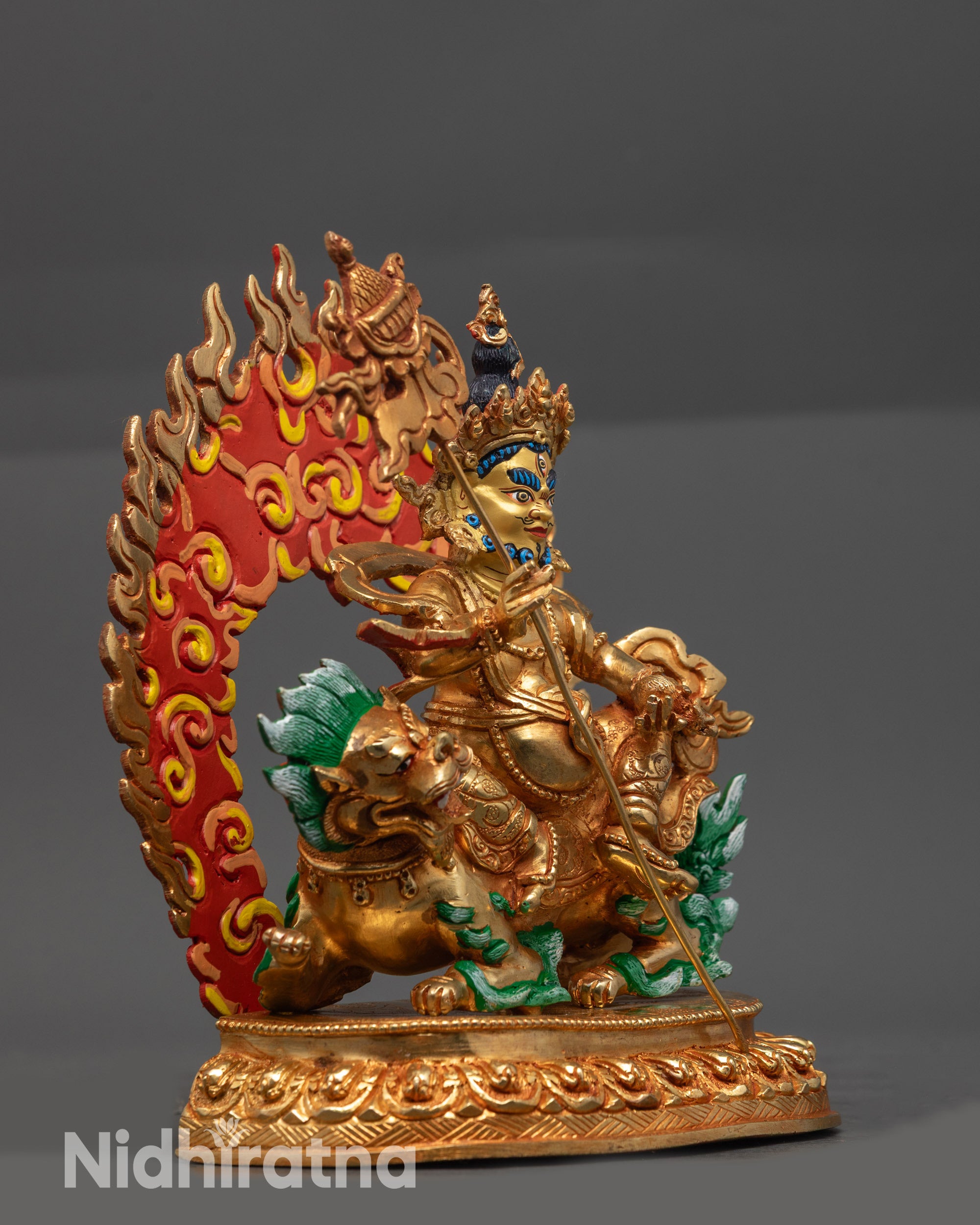 Side view of Namtoshe seated on snow lion holding Victory Banner and jewel-spilling Mongoose