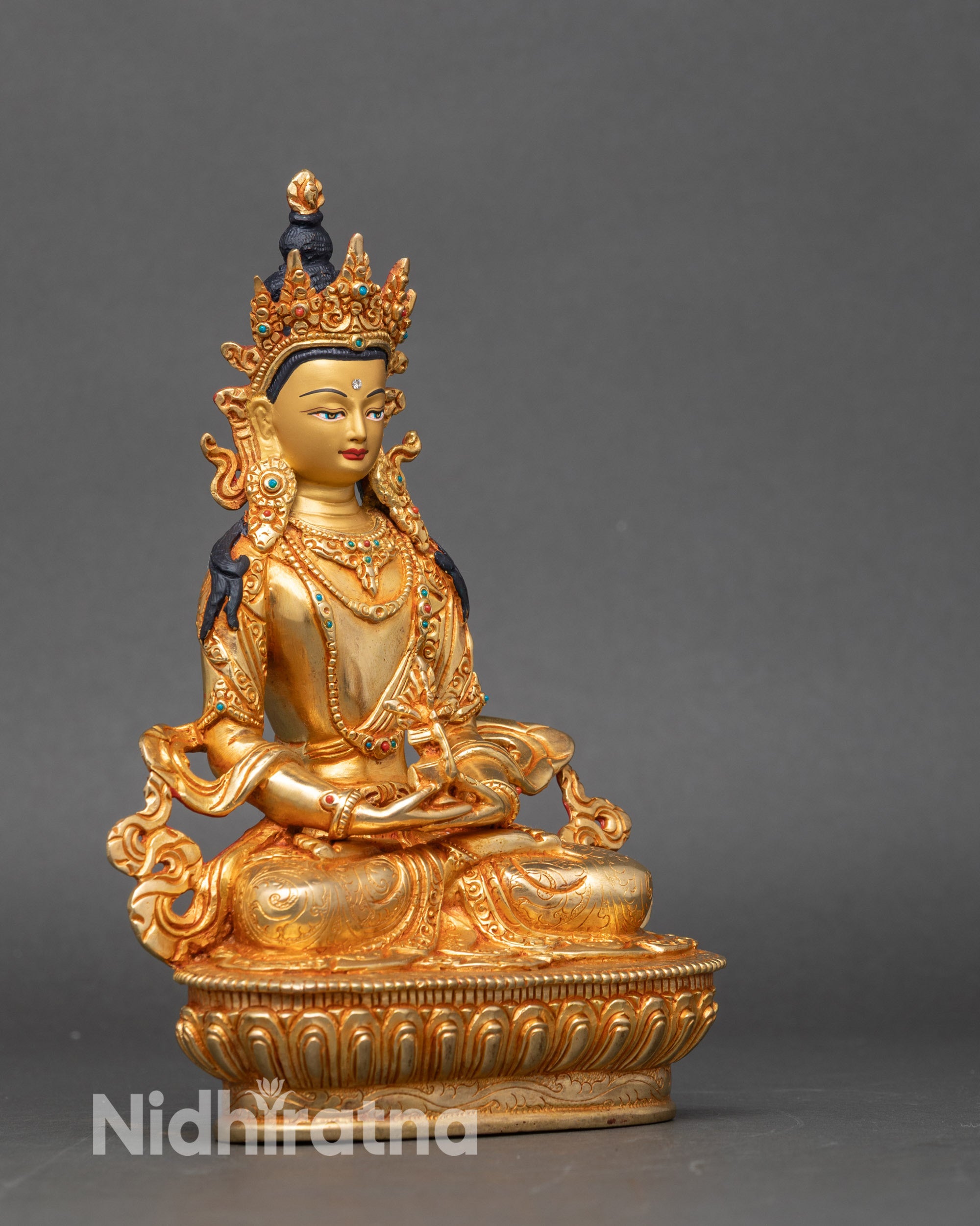 Side view of Nepalese Amitayus statue highlighting intricate craftsmanship and spiritual art