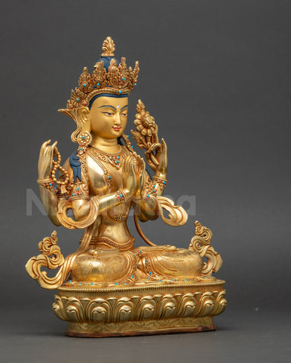 Side view of Nepalese Chenrezig statue holding crystal rosary, lotus, and wish-fulfilling gem